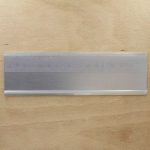 A name plate holder for doors and walls