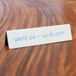 Tent style dry wipe name plate for desks