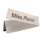 A name plate holder for desks