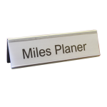 A name plate holder for desks