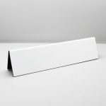 A name plate holder for desks