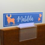 A name plate holder for partitions