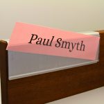 A name plate holder for partitions