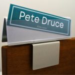 A name plate holder for partitions