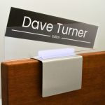 A name plate holder for partitions
