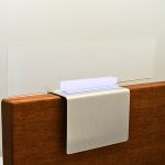 A name plate holder for partitions