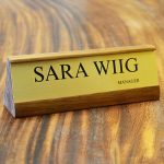 a name plate holder for desks made from wood with a printed insert example