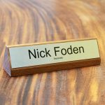 a name plate holder for desks made from wood with a printed name plate example