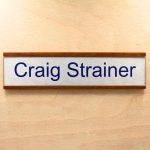 a name plate holder for doors and walls made from wood with a printed insert example