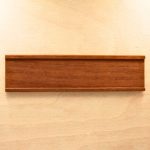 a name plate holder for doors and walls made from wood